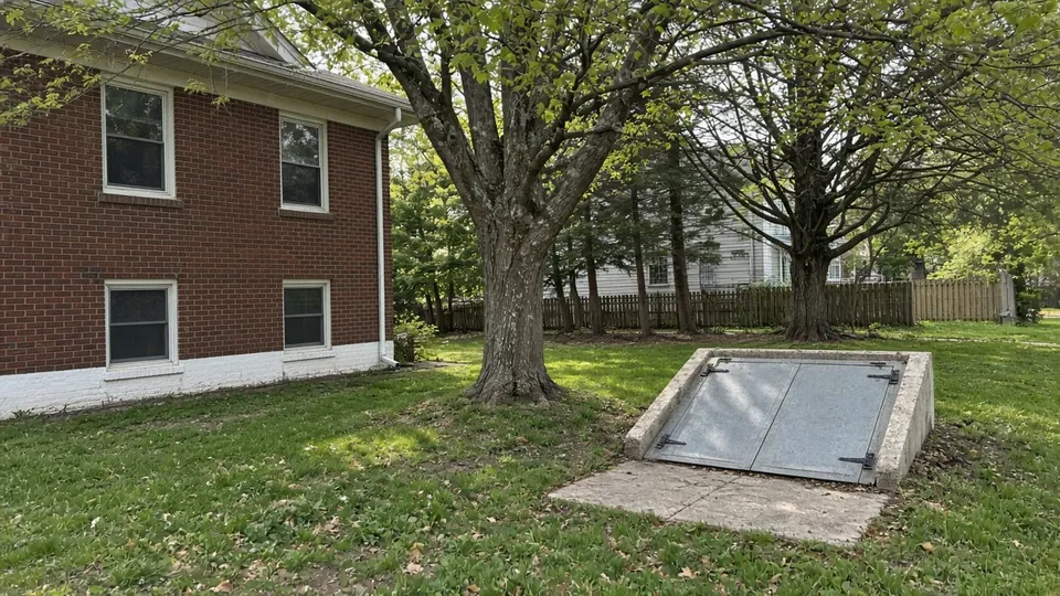Example photo of older brick homes on a tree-lined Indiana city street